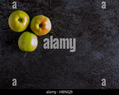 Top view of green apples on a black stone table Stock Photo