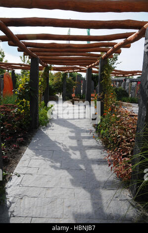 Garden with pergola and pavement Stock Photo