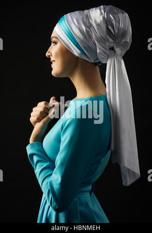 Young muslim girl on black Stock Photo