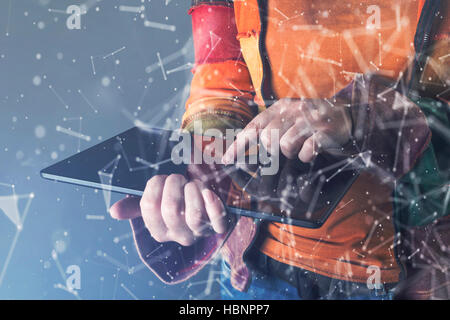 The cyber criminal, person using a tablet in deep web cyberspace. Stock Photo