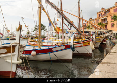 Boats in a French harbour - edited so that you can place your own name on the name plate Stock Photo