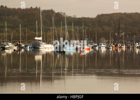 High tide at Kirkcudbright, winter boats reflected in the glass like river Dee looking up to Kirkcudbright and its harbour, Galloway, Scotland, UK Stock Photo