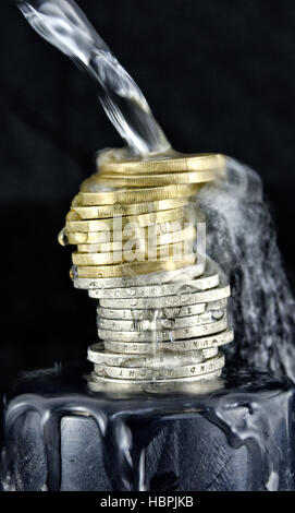 water spluttering over Euro coins Stock Photo