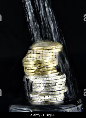 water spluttering over Euro coins Stock Photo