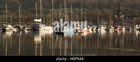 High tide at Kirkcudbright, winter boats reflected in the glass like river Dee looking up to Kirkcudbright and its harbour, Galloway, Scotland, UK Stock Photo