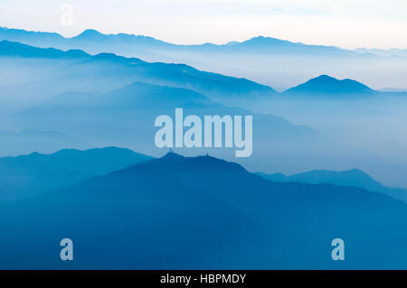 scenic foggy atmosphere above Japanese mountains by early morning Stock Photo