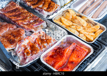 Grilled meat and sausages on a grill Stock Photo