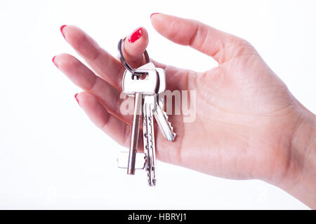 Woman hand holding keys Stock Photo