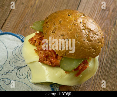 Tavern sandwich -  sandwich originally consisting of unseasoned ground beef on a bun, mixed with sauteed onions, and sometimes topped with pickles. Stock Photo