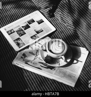 Coffee Americano Espresso Newspaper Couch Brownie Digital Tablet Concept Stock Photo