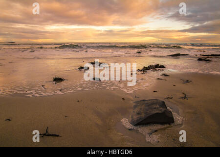 Winter sunset on Seahouses beach, Northumberland Stock Photo