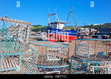 Colourful trawler pulled up on Hastings Stade fishermen's beach, East Sussex, England, UK, GB Stock Photo