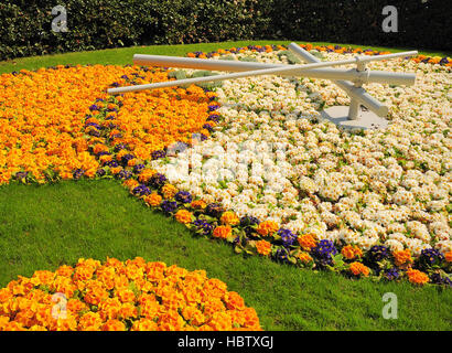 Close up of clock made from flowers in a park in  Geneva Switzerland Stock Photo