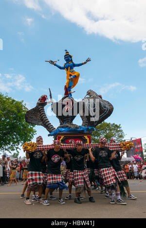 Group of men holding traditional sculpture. Nyepi ceremony in Bali Stock Photo