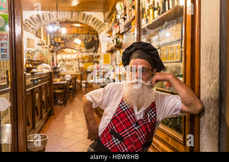 The owner of Da Aristo Di Togneri Lorenzo bar and restaurant in Piazza Salvi. Proud to be twinned with Scotland. Barga, in Tuscany, Italy. Stock Photo