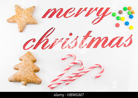 Merry christmas note cut out of white paper Stock Photo
