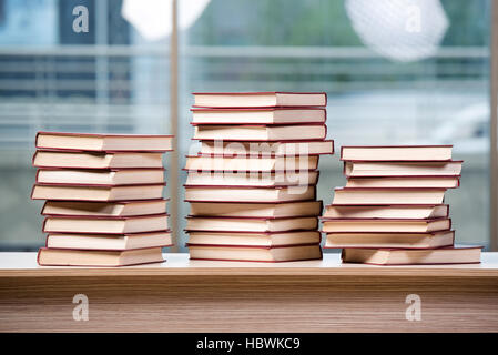 Stack of books arranged the office desk Stock Photo