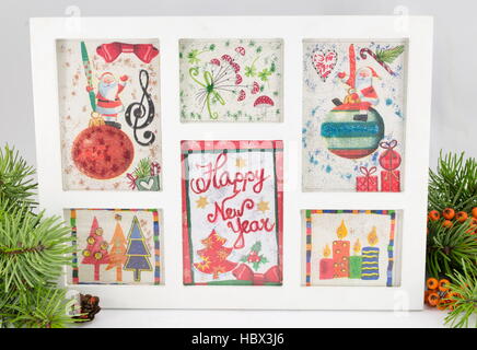 Decoupage New Year decorations made of paper in a frame Stock Photo