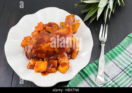 pineapple chicken thigs with barbeque and chilli sauce Stock Photo