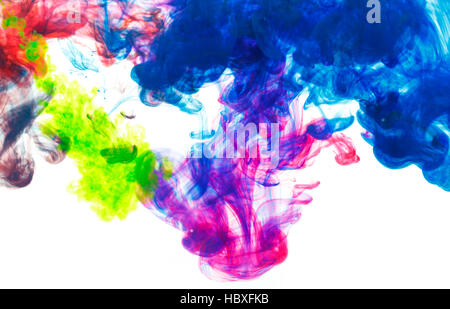 Color drop underwater creating a silk drapery. Ink swirling underwater. Cloud of colorful ink Stock Photo