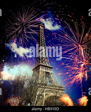 abstract background of Eiffel tower with fireworks, Paris, France - New Year Stock Photo