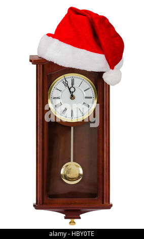 Wall clock and cap of Santa Claus, isolated on white background Stock Photo