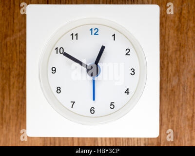 The second series of the sequence of time on the simple white analog clock , 7/96 Stock Photo