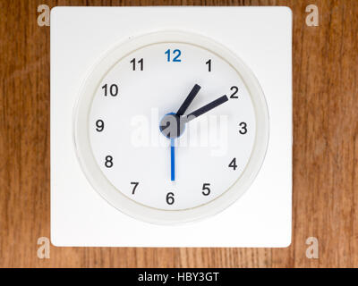 The second series of the sequence of time on the simple white analog clock , 10/96 Stock Photo