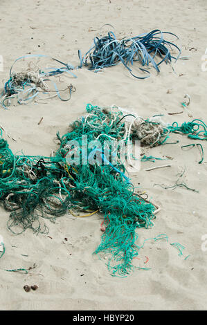 Plastic twine and rope litter the beach at Pacific City, Oregon. Stock Photo