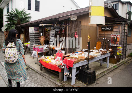 Thai woman visit and buy snack and candy alley japanese style called Kashiya Yokocho at Kawagoe town is also known as Little Edo on October 19, 2016 i Stock Photo