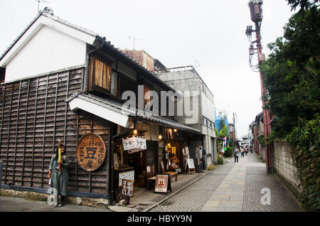 Thai woman visit and buy snack and candy alley japanese style called Kashiya Yokocho at Kawagoe town is also known as Little Edo on October 19, 2016 i Stock Photo