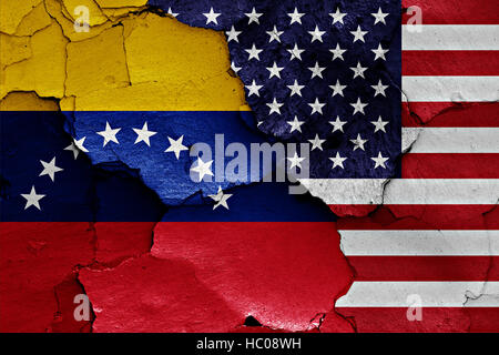 flags of Venezuela and USA painted on cracked wall Stock Photo