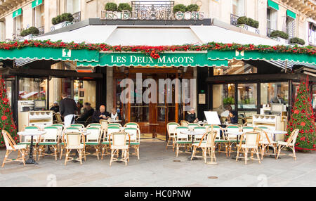 Paris, France-December 05, 2016: The famous cafe Les deux magots decorated for Christmas located on Saint-Germain boulevard in Paris. Stock Photo