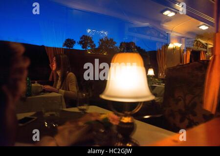 Inside of Transcantabrico Gran Lujo luxury train travellong across northern Spain, Europe. Interior of restaurant car Stock Photo
