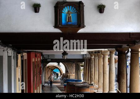 Arcades and columns in Galiana street in the famous ancient city of Aviles, Asturias, Spain. One of the stops of the Transcantabrico Gran Lujo luxury Stock Photo