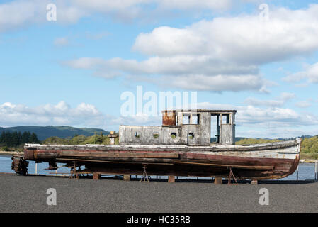 Old boat sitting outside of the Coos History Museum in Coos Bay, Oregon. Stock Photo