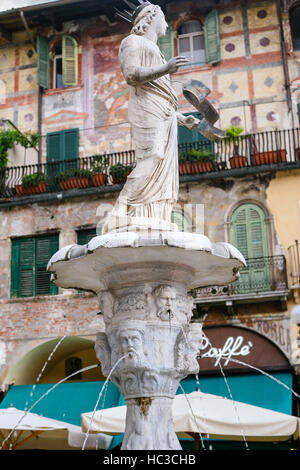 VERONA, ITALY - OCTOBER 10, 2016: fountain with roman statue called Madonna Verona (built in 1368 by Cansignorio della Scala) on Piazza delle Erbe (Ma Stock Photo