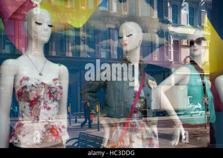 Reflections in a window of one of the shops in the center of Belfast, Northern Ireland, UK.  With award-winning designers, an array of shops to rival Stock Photo