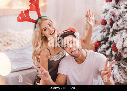 Joyful funny couple enjoying themselves Stock Photo