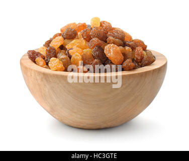 Wooden bowl of assorted raisins isolated on white Stock Photo