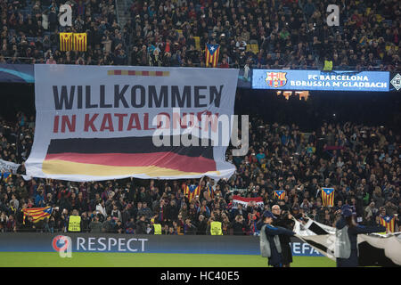 Barcelona, Spain. 6th Dec, 2016. A banner reads 'Willkommen in Katalonien' (welcome to Catalonia) above a German flag at the Champions League football match between FC Barcelona and Borussia Moenchengladbach at the Nou Camp stadium in Barcelona, Spain, 6 December 2016. Photo: Bernd Thissen/dpa/Alamy Live News Stock Photo