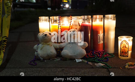 Oakland, USA. 7th Dec, 2016. Candles and plush toys are displayed to mourn the victims of a warehouse fire in Oakland, California, the United States, Dec. 7, 2016. The death toll of the worst fire in the history of Oakland stood at 36. Credit:  Xu Yong/Xinhua/Alamy Live News Stock Photo