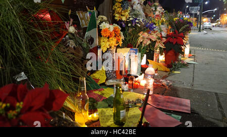 Oakland, USA. 7th Dec, 2016. Flowers, candles, notes and photos are seen to mourn the victims of a warehouse fire in Oakland, California, the United States, Dec. 7, 2016. The death toll of the worst fire in the history of Oakland stood at 36. Credit:  Xu Yong/Xinhua/Alamy Live News Stock Photo