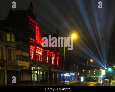 Morecambe, Lancashire, United Kingdom. 7th Dec, 2016. Morecambes Historic Winter Gardens has been bathed in red light this Christmas Whilst the sky is being lit from the Art Deco Midland Hotel Credit:  David Billinge/Alamy Live News Stock Photo