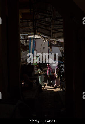 Aceh, Indonesia. 8th Dec, 2016. People pass a collapsed building at Meureudu market in Pidie Jaya district in Aceh, Indonesia, Dec. 8, 2016. Rescuers on early Thursday resumed the search for survivors in a powerful earthquake that hit the western Indonesian province of Aceh, killing at least 97 people. Credit:  Veri Sanovri/Xinhua/Alamy Live News Stock Photo