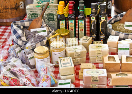 BREMEN, GERMANY - SEPTEMBER 18, 2010: A stall with natural oils, soap, honey and dried flowers on an outdoor market in Bremen. Stock Photo
