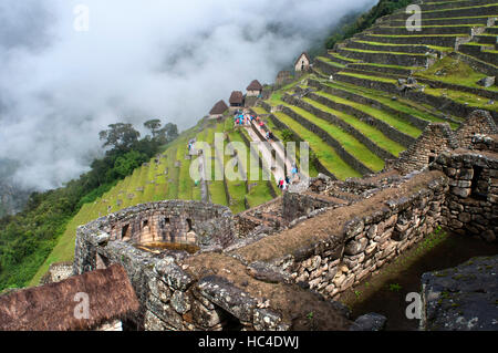 Terraces inside the archaeological complex of Machu Picchu. Machu Picchu is a city located high in the Andes Mountains in modern Peru. It lies 43 mile Stock Photo