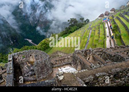 Inside the archaeological complex of Machu Picchu. Machu Picchu is a city located high in the Andes Mountains in modern Peru. It lies 43 miles northwe Stock Photo