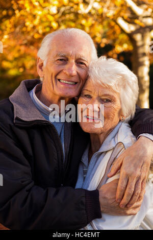 Portrait of a happy elderly couple embracing Stock Photo - Alamy