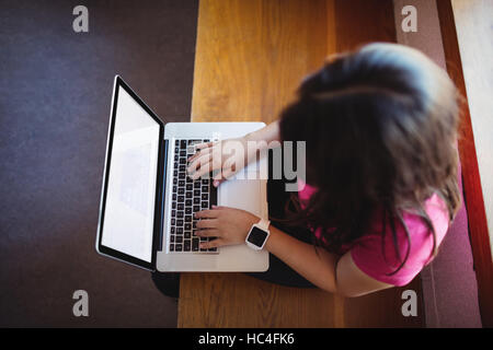 Female student using laptop Stock Photo
